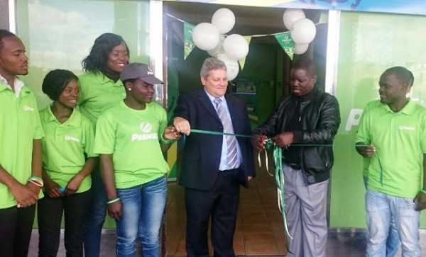 Glover helps Malawi Gaming Board chair Billy Banda opening of the company