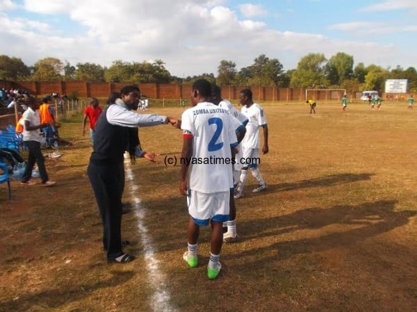 Gobede (left) issues instructions to his players after the second goal.