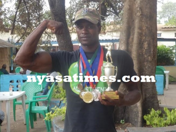 Gondwe with some of the medals he has collected  during his career