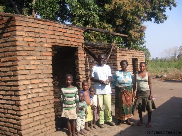 Gondwe's family with their torched house
