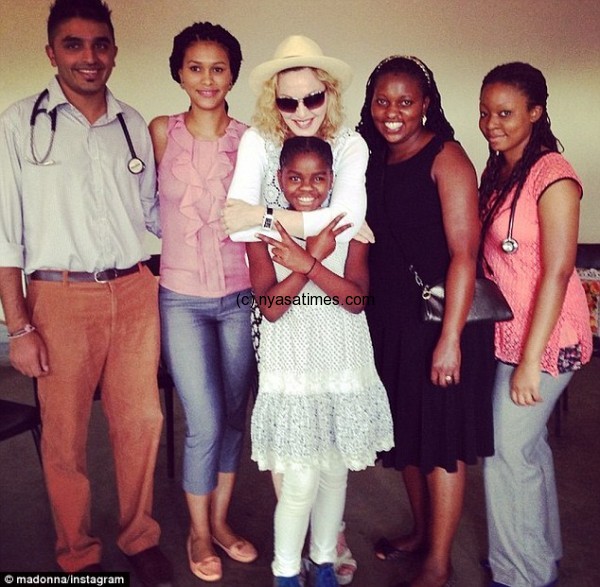 Good cause: Madonna also visited the Queen Elizabeth Hospital in Blantyre, Malawi's second largest city and commercial capital, seen here with surgical trainees and her daughter