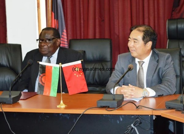 Minister of Finance Goodaal Gondwe and Chinese envoy Zhang during the signing ceremony of Malawi Government and the Peoples Republic of China.