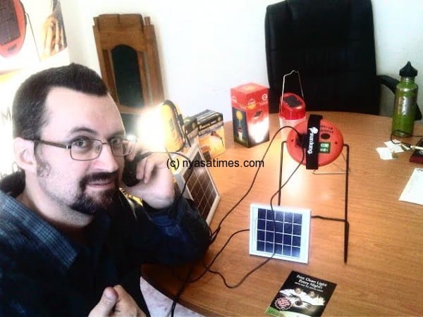 Gordon with his solar lamps