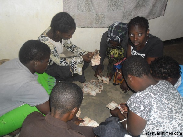 Group members verifying the money recieved