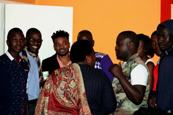 Gwamba interacts with UNFPA officials, the media and fellow musicians at istening party. Photo courtesy of Pencils PR