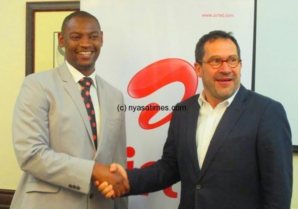 Hands shake between Fam and Airtel Malawi.....Photo Jeromy kadewere