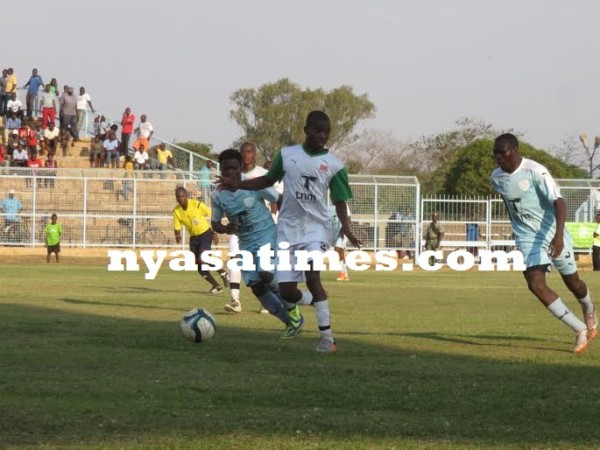 Harawa, Richard Mbulu fight for the ball.