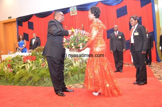 Here you are love! President Mutharika present valentine flowers to First Lady