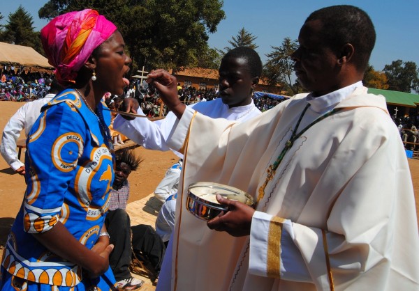MP Juliana Lunguzi receiving Eucharist from Bishop Emmanuel Kanyama...Photo Jeromy Kadewere