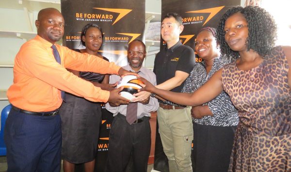 Be Forward Wanderers presenting balls to Mvayani school teachers