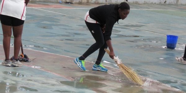 Sweeping the water away at the netball court