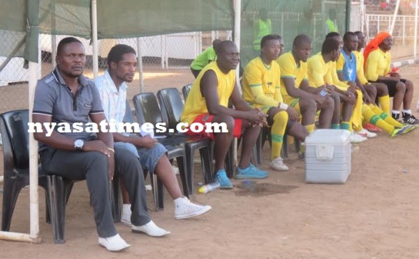 Impressed with his boys- Civo's coach Kaunda (far left)