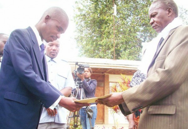 Bina Shaba (right) presents the petition on federalism