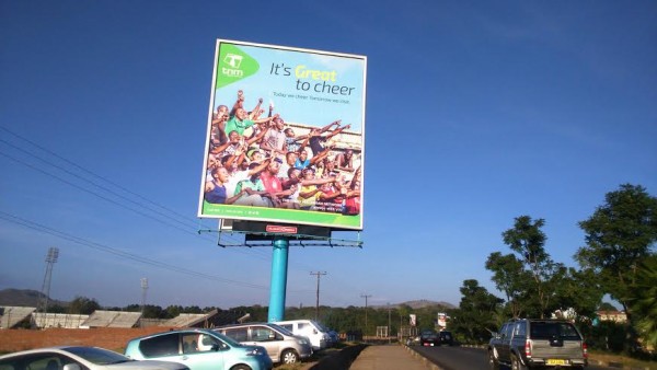 -It’s Great to Cheer, is one of the billboards near Kamuzu Stadium in Blantyre along the main highway. The stadium is the home of the Malawi Super League which is sponsored by TNM