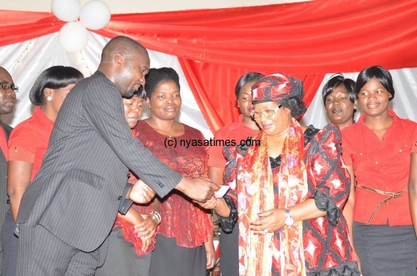 Ex-Malawi leader Joyce Banda presents her cheque