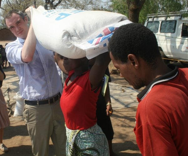 UK Minister for the Department for International Development (DfID) James Wharton giving maize donation to the hungry in Chikwawa, Malawi