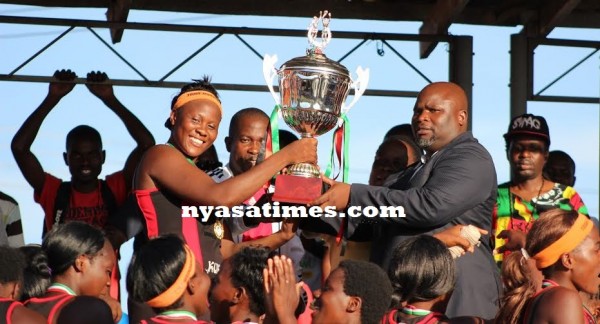 James Chuma handing over the trophy Carol Mtukule...Photo Jeromy Kadewere
