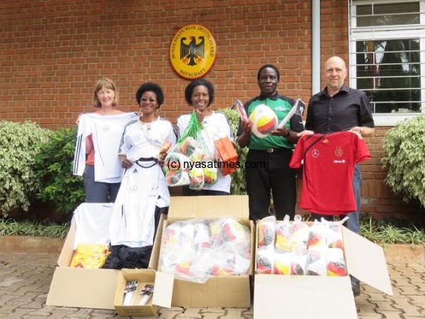 Johannes (far right), Phiri, Mpuwani, Banda and Andrea show off the items