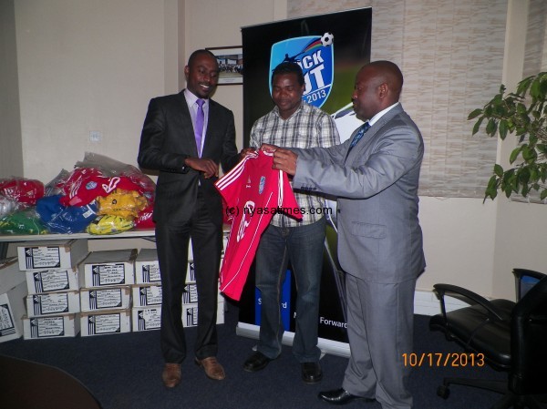 Jonazi (Black suit) and Mwenda present the kit to BB's Austin Kasito, Pic Leonard Sharra