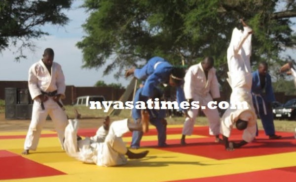 Judo athletes performing during the handover ceremony
