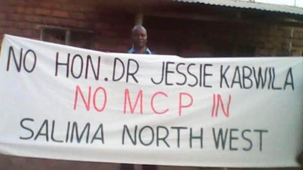 Kabwila supporter carrying placard