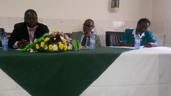 Kalengo, Christopher Banda, Guy Banda and disease awareness cordinator Kadam'manja (in green uniform)