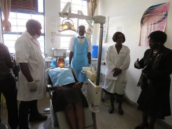 Kalinde discuses with dental therapists before an operation