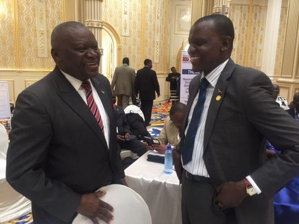 Kasaila (r) shares a light moment with Malawi Congress Party Member of Parliament Joseph Njovuyalema during the SADC Summit - Pic by Chikondi Chimala, Mana