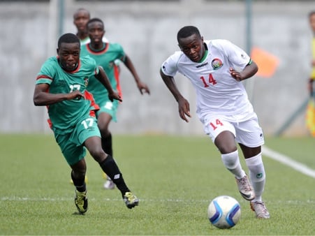 Kenneth Mukuria of Kenya is challenged by Moses Jnr Chipanda of Malawi during the 2016 Cosafa Cup match between Malawi and Kenya at Saint Francois Xavie, Port Louis Mauritius on 26 July 2016. BackpagePix'