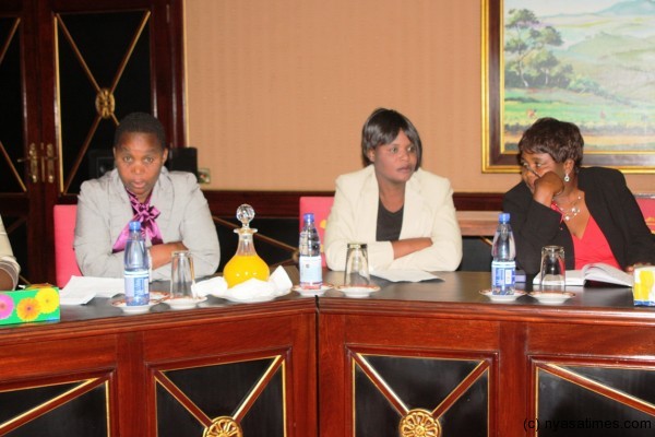 Lady members of MCTU listen to remarks by President Joyce Banda