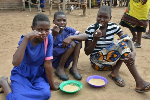 Learners_of_Mbwemba_Primary_School_enjoying_the_porridge._pic_by_Felix_Washon