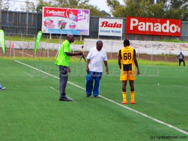 Leo Mpulula and Robin Alufandika doing some pep talk to their player