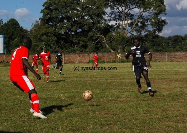 Lions' Innocent Bokosi (left) challenges Eagles' Mustafa Shaibu to the ball