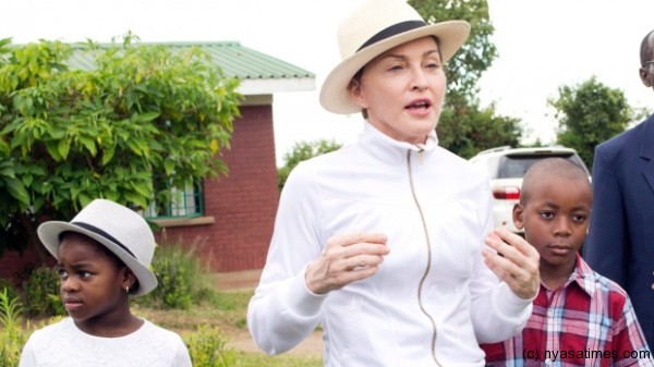 Madonna with Mercy and David Banda  tours the Mphandura orphange near Lilongwe, Malawi on April 5, 2013. (AP Photo/Thoko Chikondi)