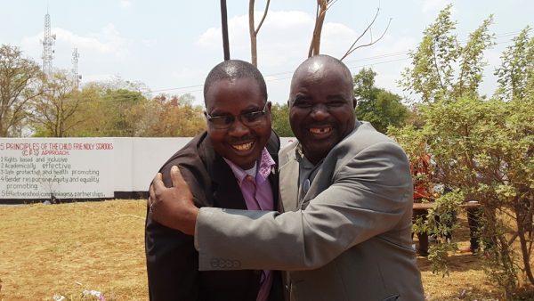 Congratulations! DPP's losing candidate Stephano Kamwani (right) congratulates Mchinji West MP -elect of MCP, Jephter Mwale