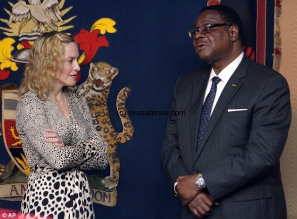 Madonna laughs with Malawian President