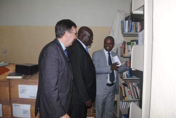 Majawa (in grey suit) briefing Mkandawire inside Mzuni  'interim' Libray as Ridley looks on - Pic by Yohane Chideya, Mana