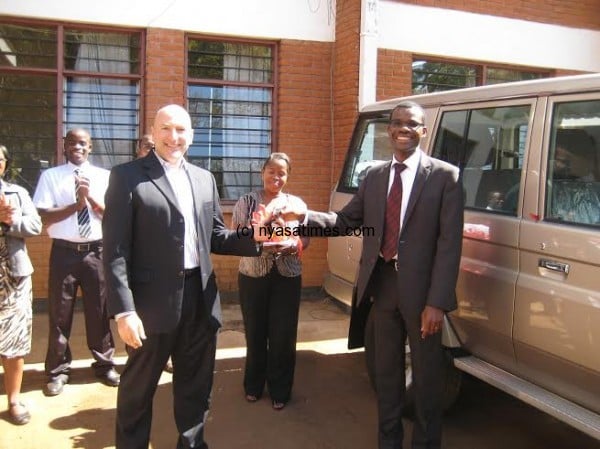 Makoka receving the vehicle from CDC officials Mr Singer.