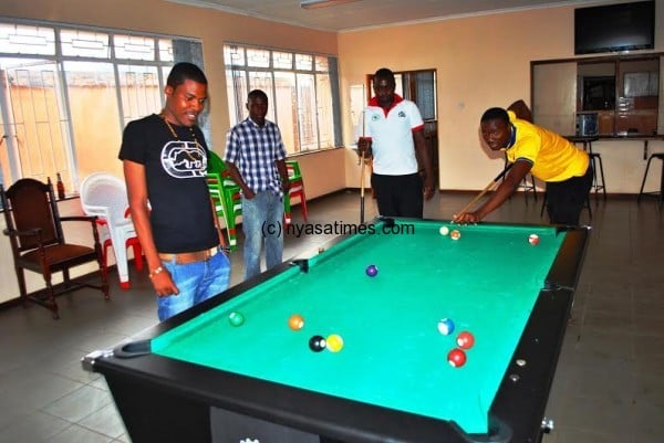 Malawi News Agency Sports reporter Arkangel Tembo and friends enjoying a game of pool at Mpira Sports Bar