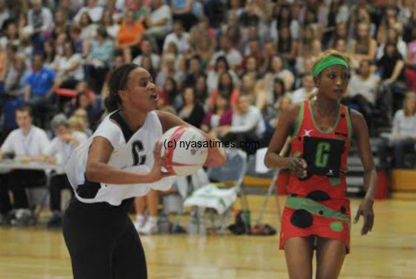 Malawi Queens Tina Kamzati in action with England second string