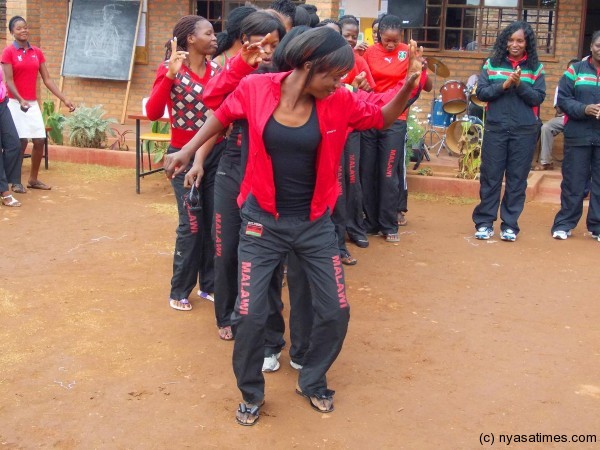 Malawi Queens players jiving after the function led by Jessica Mazengera upfront.....Photo Jeromy Kadewere
