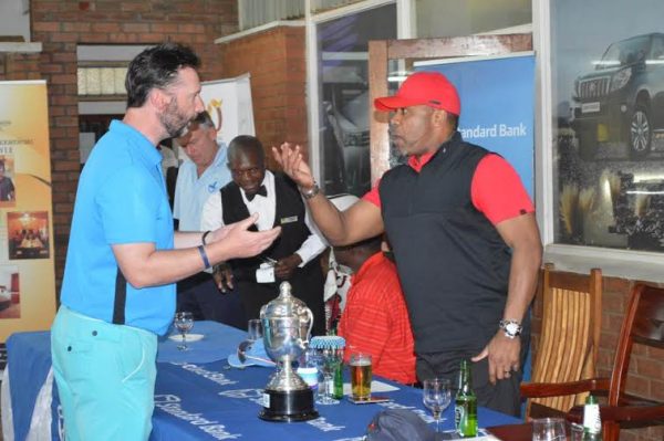 Malawi VP Chilima with British envoy Nevin at golf club