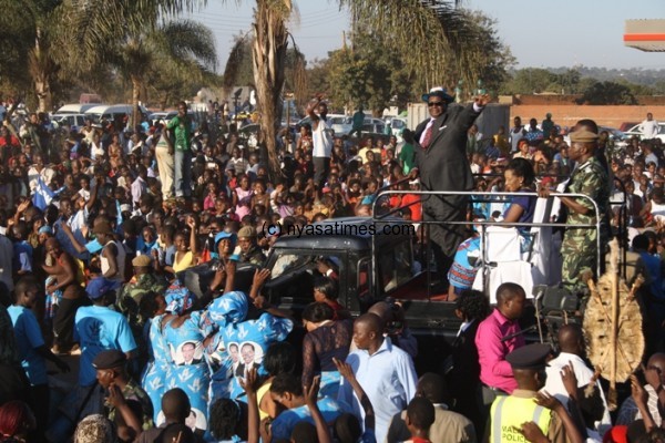 Malawi leader Peter Mutharika waves at thousand of people who came to welcome him in Lilongwe.