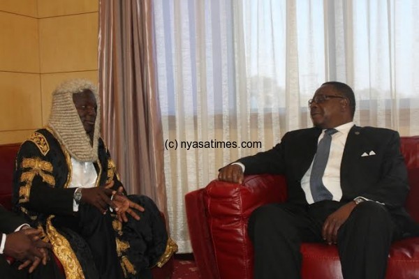 Malawi leader Prof Peter Mutharika shares a light moment with Speaker of Parl ... sowoya before opening the 45th Session of Parliament-pic by Lisa Vintulla.