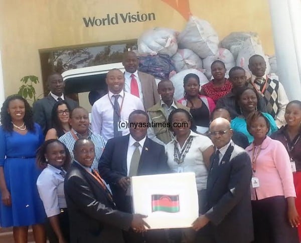 Malawians in Kenya present the donation led by High Comissioner Marcel Chirwa