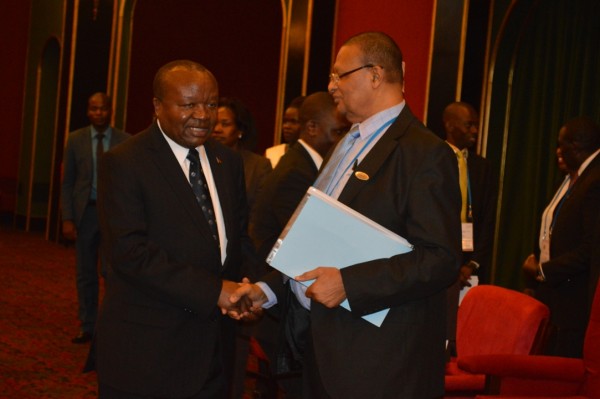 Malawis Chief Secretary George Mkondiwa welcomes President of the council of African Cabinet Secretaries,Ernest Surru to Malawi(C) Stanley Makuti