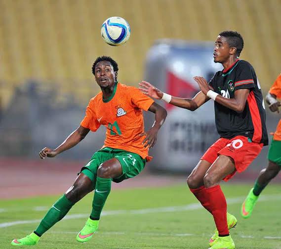 Malawi's Gerald Phiri (right) chasing for the ball