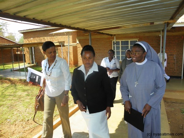 Malila in white shirt, Nyang'wa  centre and Lungu