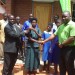 Malisa ( in green t-shirt)  and Paulo in the middle handing over a key to Primary Education Advisor for Nsundwe a Mr Phiri
