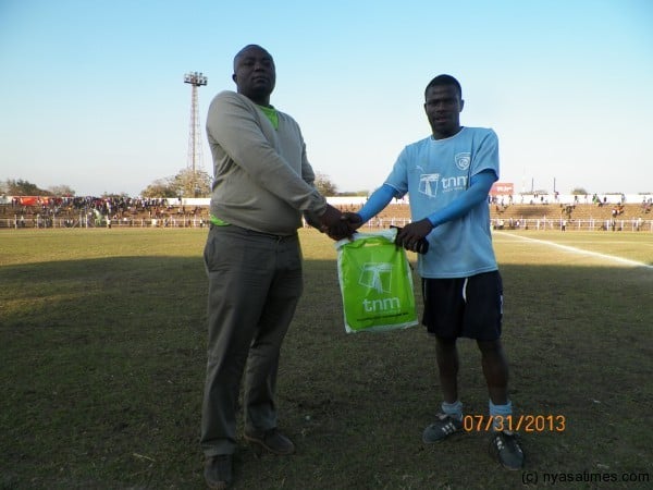 Man of the match Frank Banda receives his award, Pic Leonard Sharra, Nyasa Times